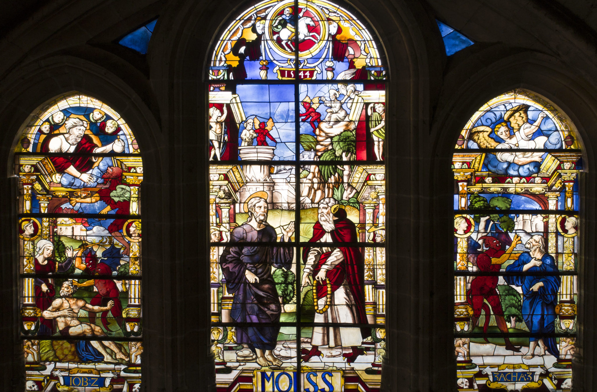 The temptations of Christ. Stained glass window of the Cathedral of ...