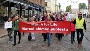 Pro-life demonstrators on a street in Helsinki, Finland.